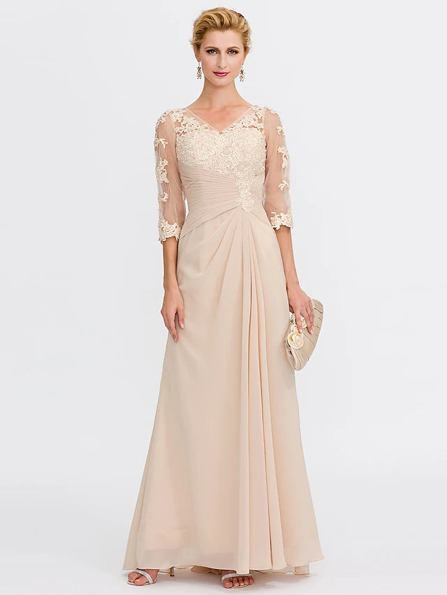 Plus size model wearing an elegant A-line V-neck chiffon Mother of the Bride dress with half sleeves and appliques.