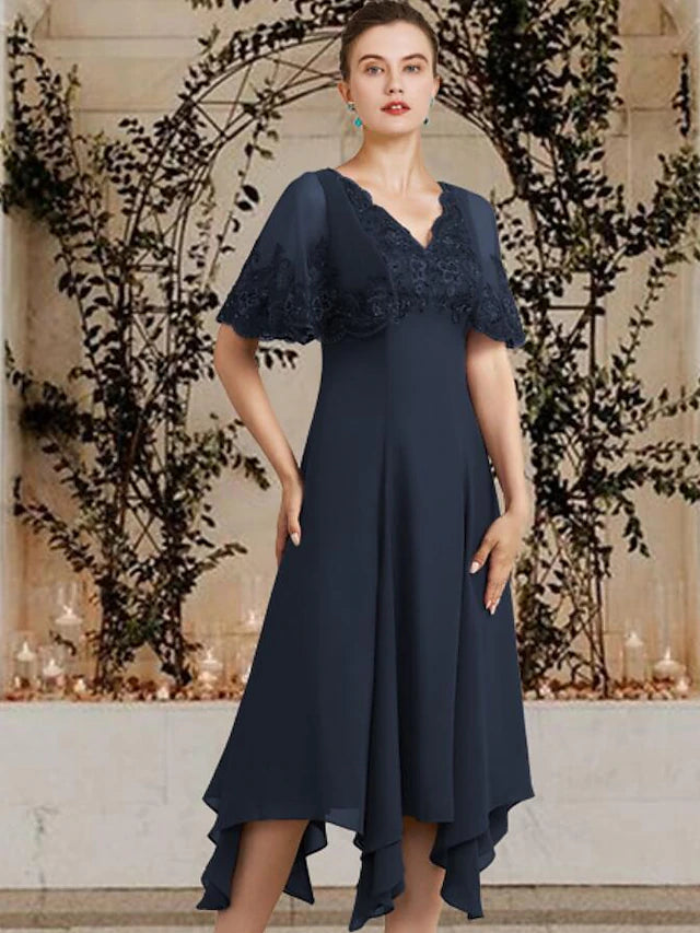 Side view of the high-low tea length chiffon and lace dress.