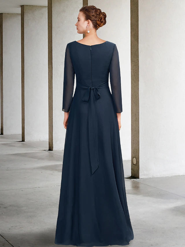 Close-up of pleats and crystal embellishments on the chiffon dress.