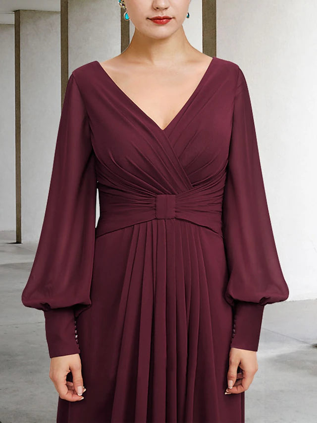 Side view of a high-low chiffon dress with pleats and ruched details.