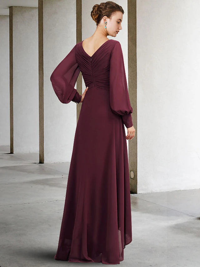 Back view of an asymmetrical floor-length formal gown.