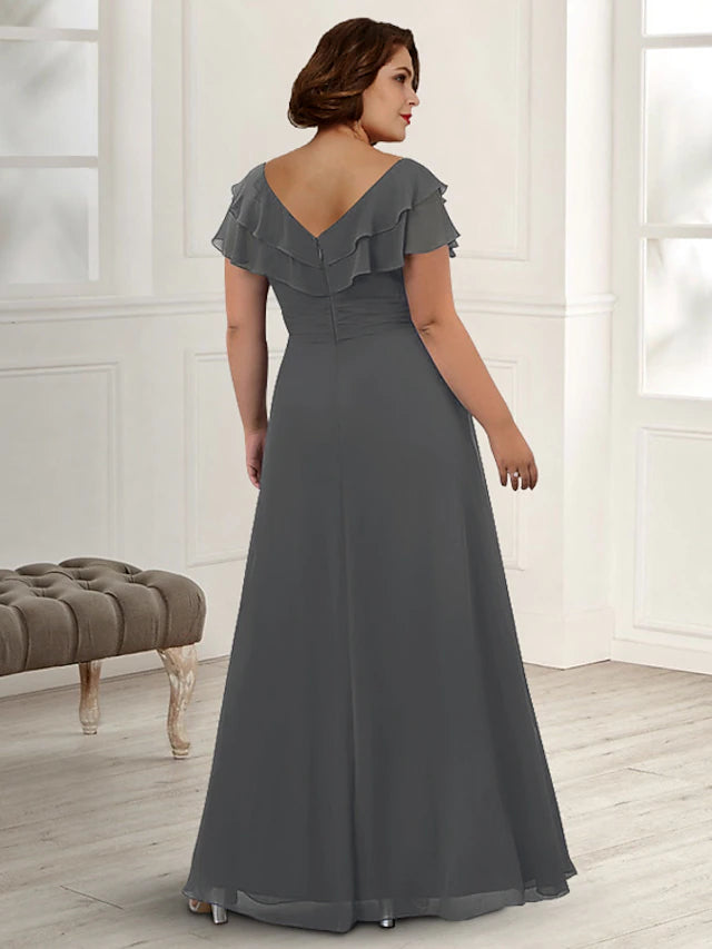Close-up of the crystal brooch and ruffled details on the elegant chiffon gown.