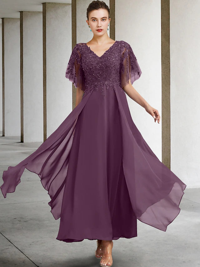 Detail of sequin appliques and lace on the elegant formal dress.