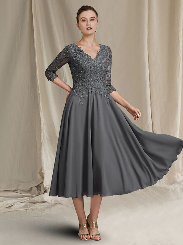 Elegant plus size A-line Mother of the Bride dress with V-neck and 3/4 sleeves.