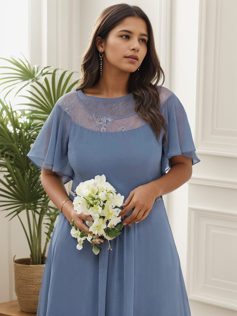 Side view of a dusty navy plus size formal dress with boat neck and sleeves.