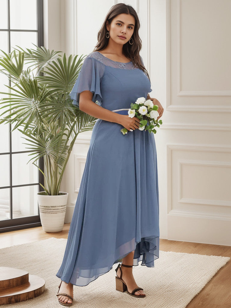 Close-up of the fabric and boat neck on a dusty navy plus size formal dress.