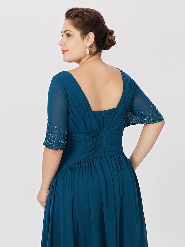 Close-up of pleats and beading on chiffon Mother of the Bride dress.