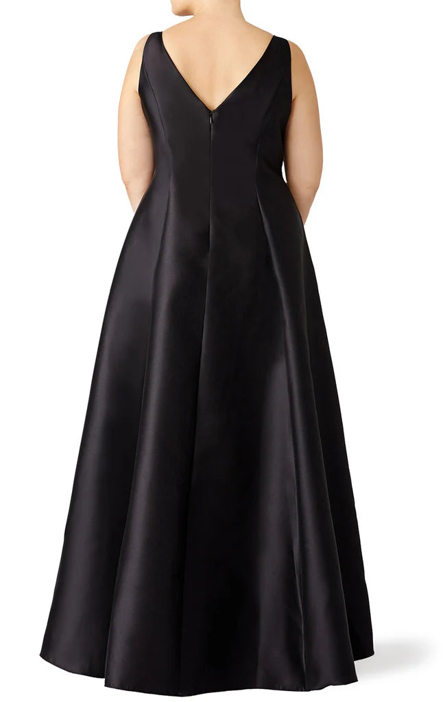 Plus size woman posing in a high neck satin evening gown with delicate straps.