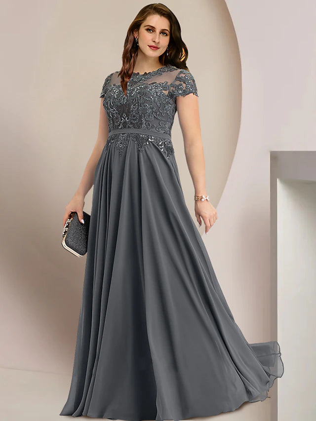Detail of sequin and lace embellishments on a formal plus size gown.