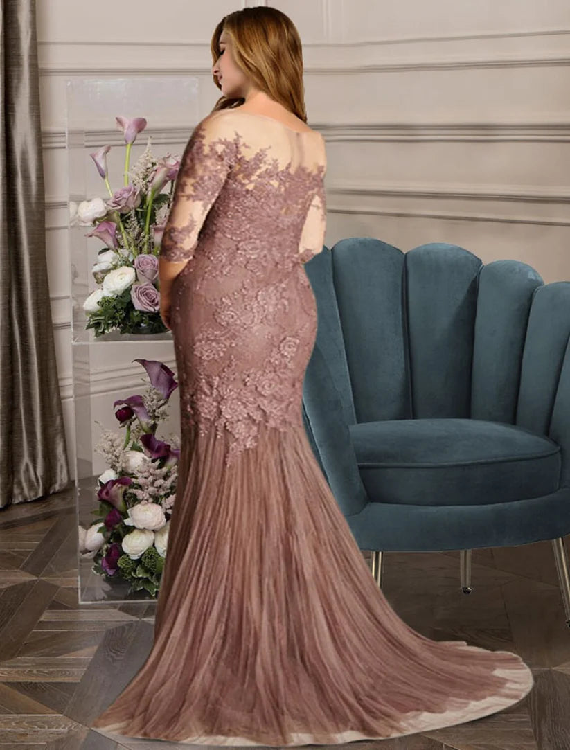 Formal plus size trumpet gown featuring a jewel neck and sweep train.