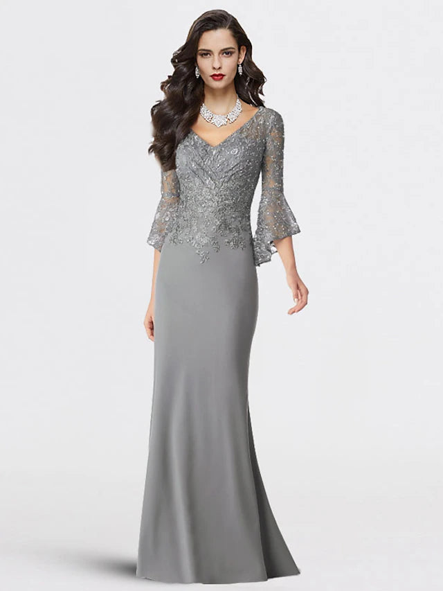Plus size Mother of the Bride dress, mermaid trumpet silhouette, V-neck, 3/4 sleeves, lace and sequin details.