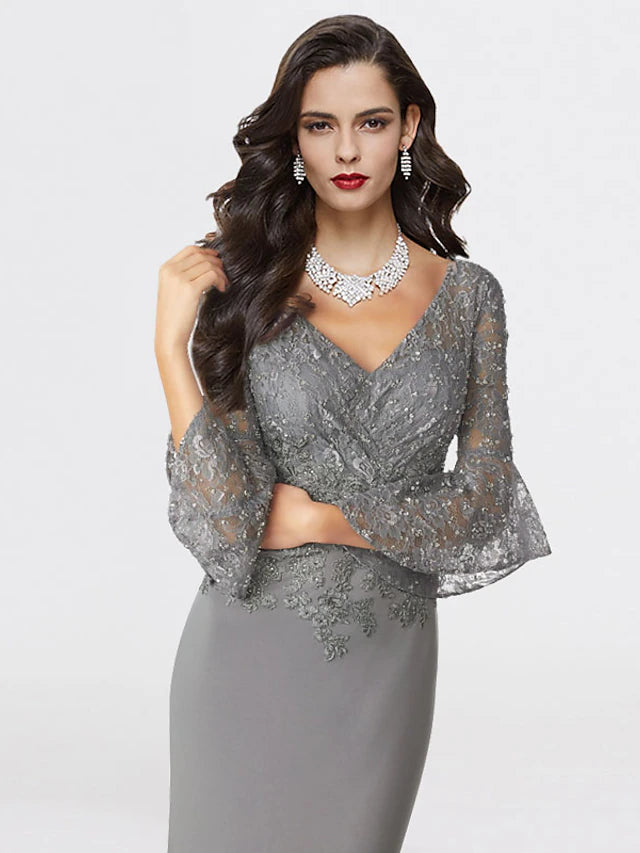 Back view of elegant plus size mermaid trumpet gown with sweep train and sequin appliques.