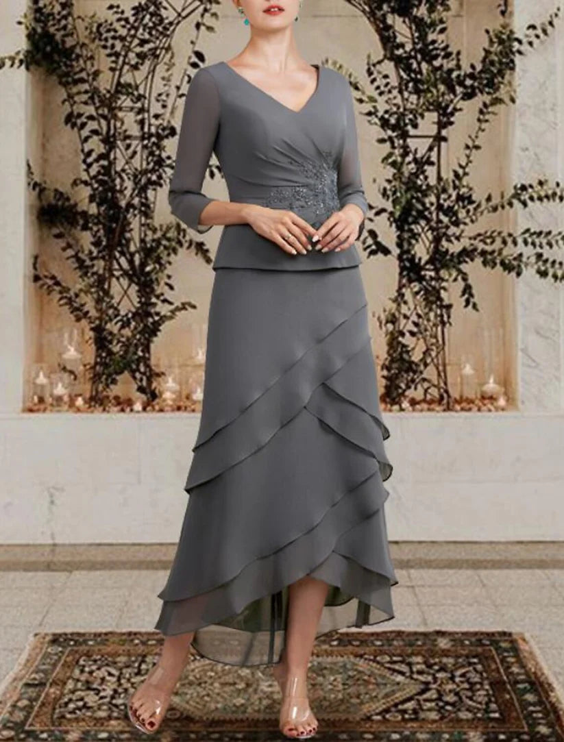 Side view of the plus size A-line dress, showcasing the high-low tea length and side-draped ruffles.