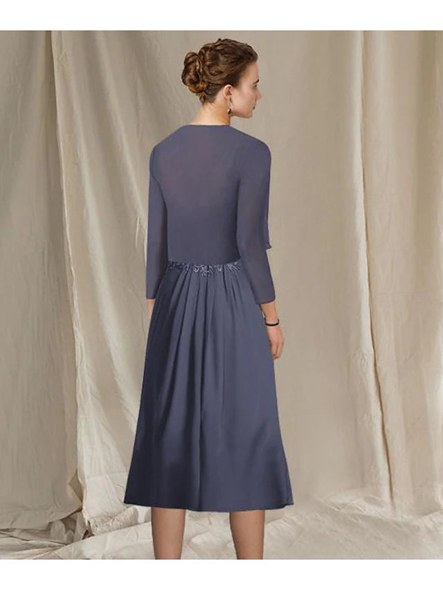 Side view of a woman wearing the tea length chiffon lace dress with appliques.