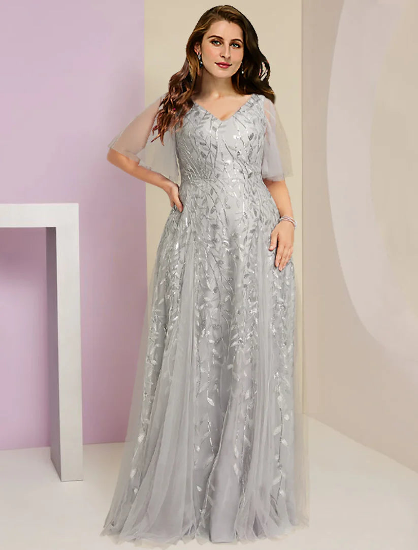 Front view of a plus size woman wearing an elegant V-neck sequin lace tulle Mother of the Bride dress with short sleeves.