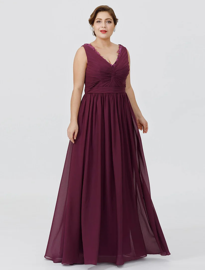 Close-up of the V-neckline and delicate appliques on the chiffon dress.
