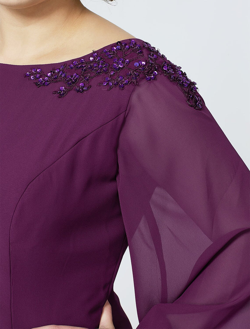 Back view of an elegant floor-length plus size formal dress.
