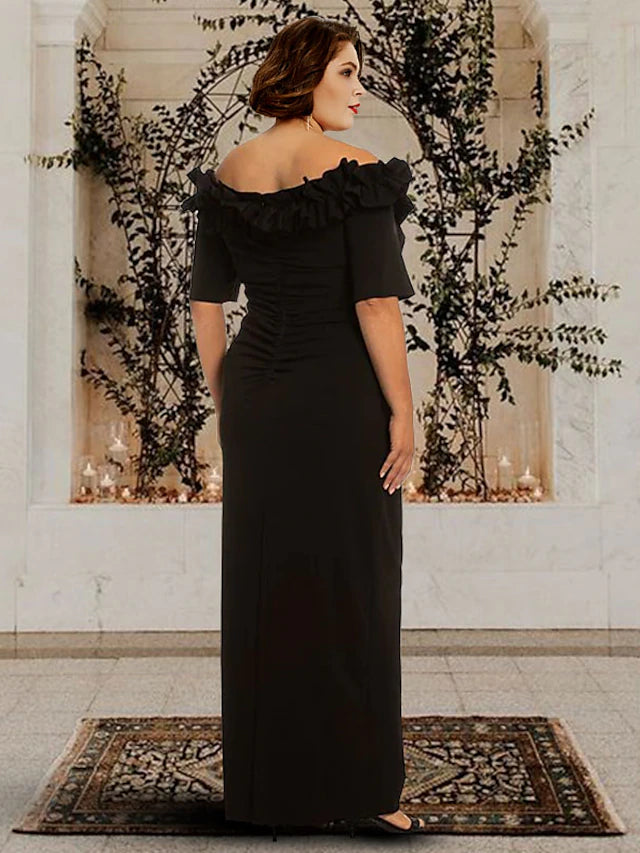Back view of an elegant plus size chiffon sheath gown, showing floor-length design and subtle ruching.