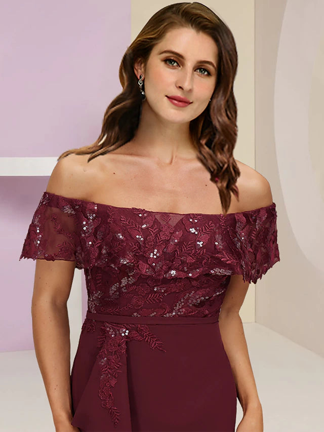 Side view of the plus size off-shoulder gown with short sleeves and sequin ruffles.