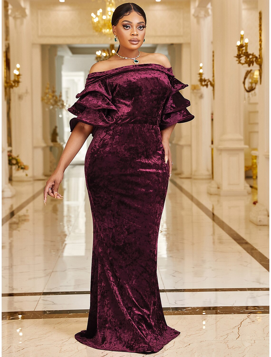 Side profile of a plus size mermaid dress, showing ruffle details.