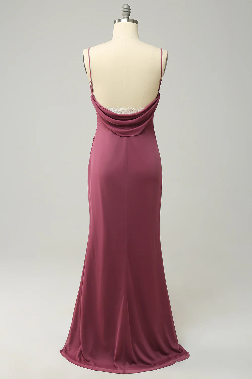 Close-up of the open back detail on the plus size long formal dress.