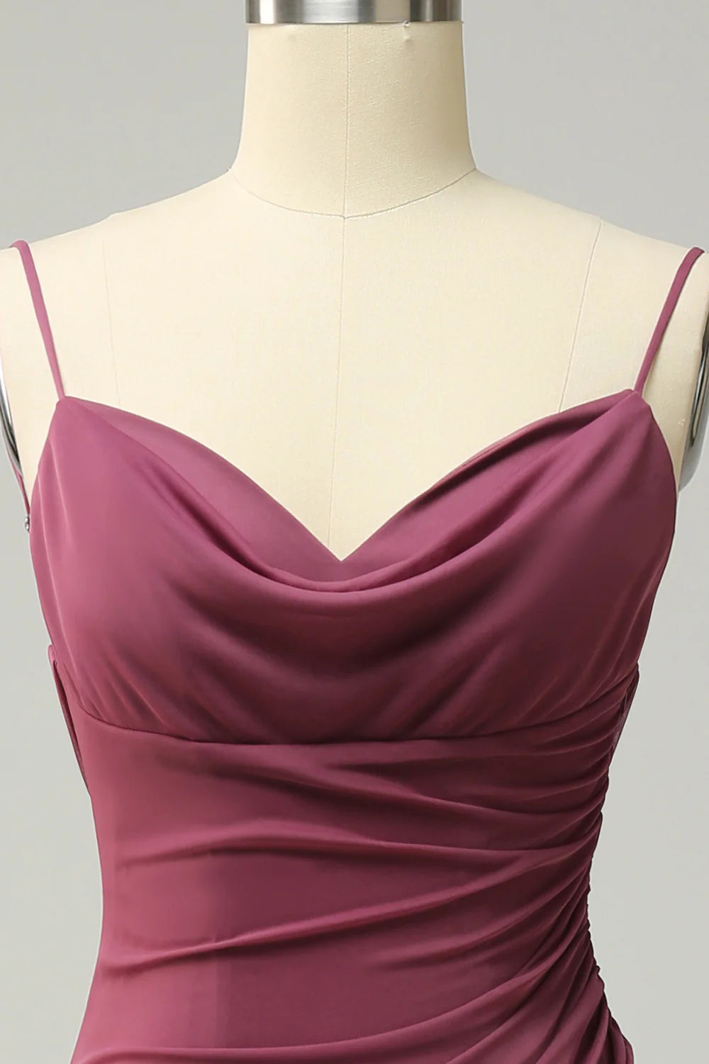 Back view of a model in a flowing plus size open back long prom dress.