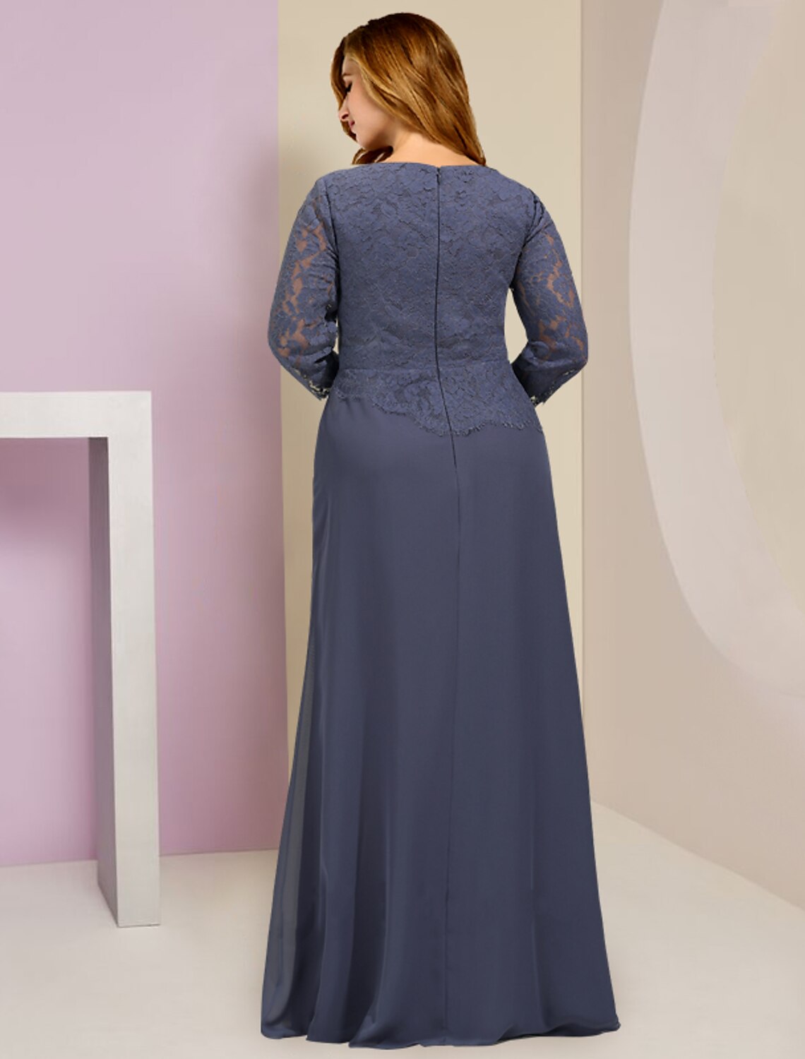 Back view of the elegant plus size chiffon and lace gown, showcasing ruffles and appliques.