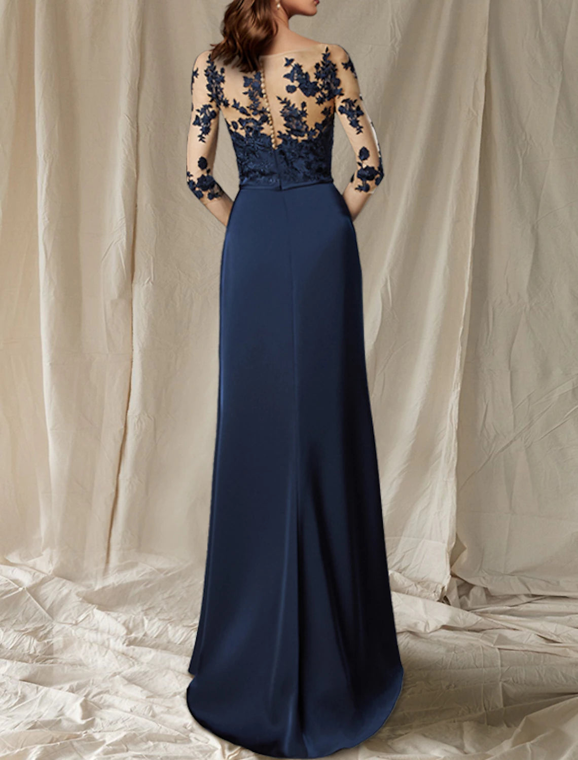 Back view of elegant plus size chiffon dress, highlighting the sweep train.
