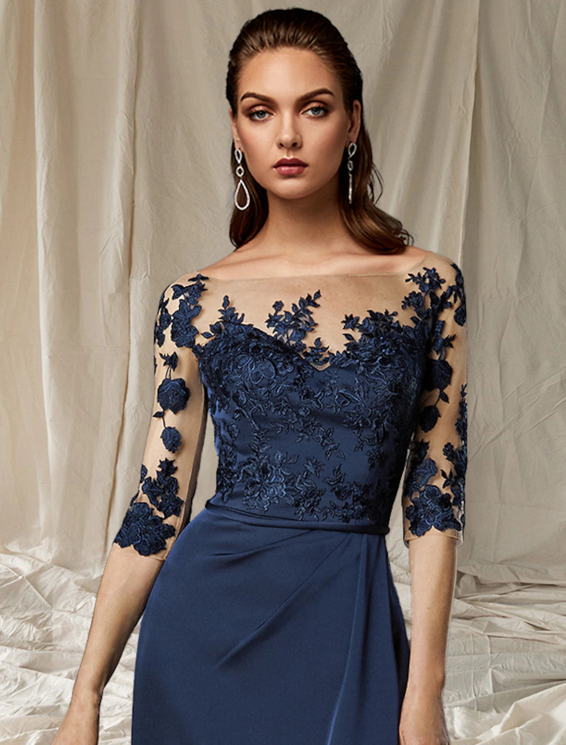 Full length view of the elegant plus size chiffon dress with jewel neck.
