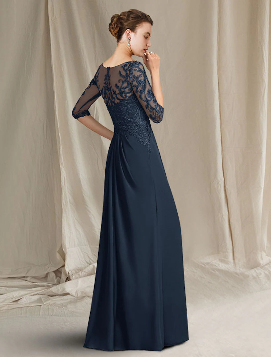 Side view of the floor-length chiffon lace mother of the bride dress.
