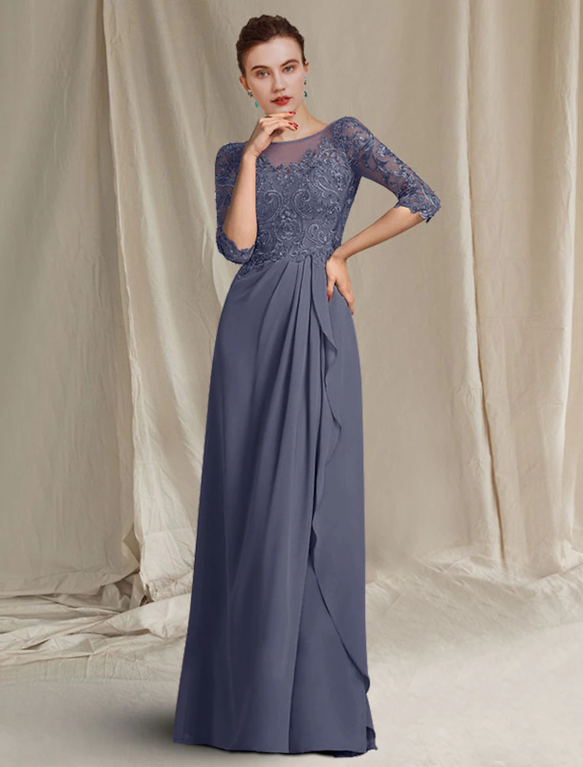 Close-up of the jewel neck and 3/4 lace sleeve on the dress.