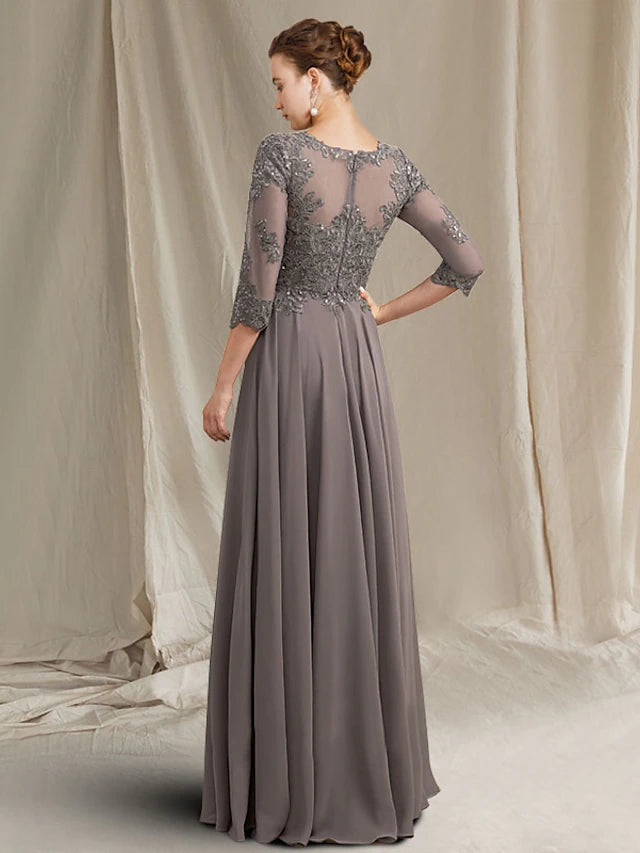 Back view of elegant formal dress showing pleats and flowing silhouette.