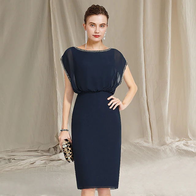 Elegant plus size Mother of the Bride sheath dress with jewel neck and cap sleeves.
