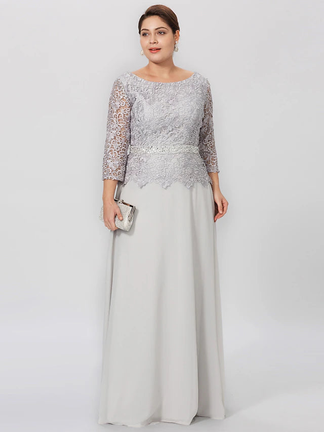 Elegant plus size Mother of the Bride dress in a sheath silhouette with jewel neck and 3/4 sleeves.
