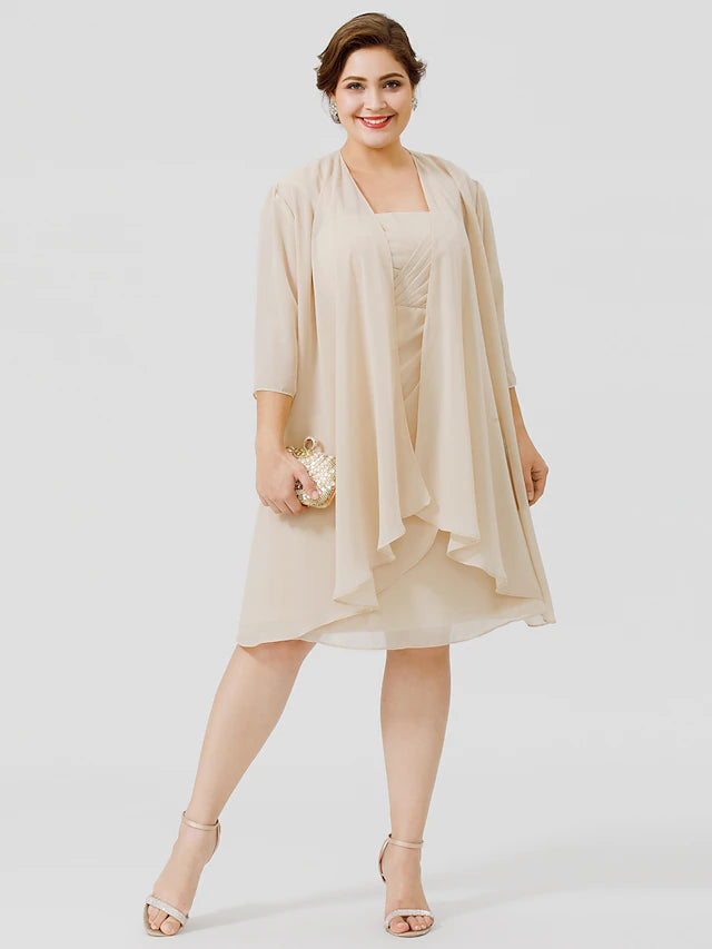Full view of an elegant plus size sheath mother of the bride dress with criss cross straps and knee-length chiffon lace.