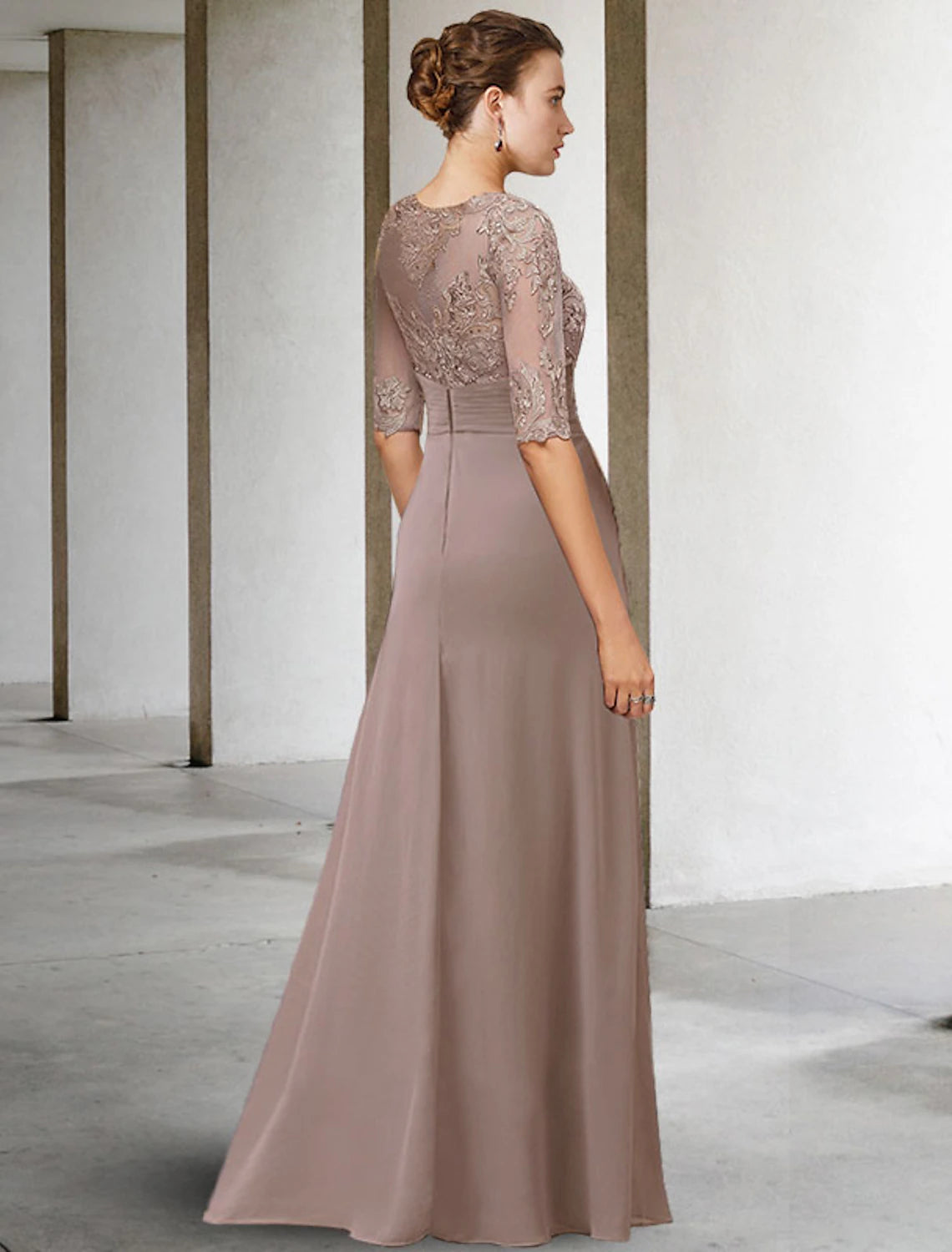 Woman walking in the plus size mother of the bride gown.