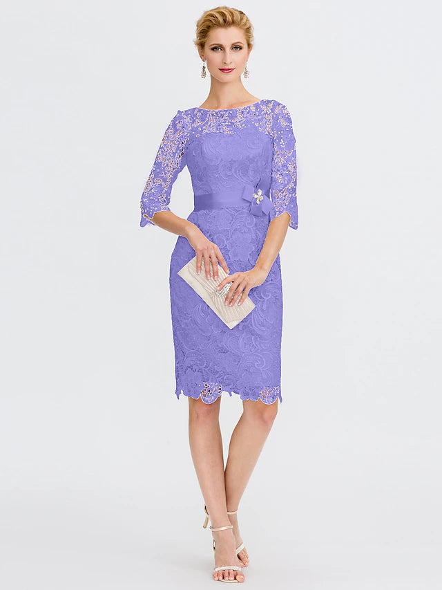 Back view of the lace sheath dress with 3/4 sleeves.