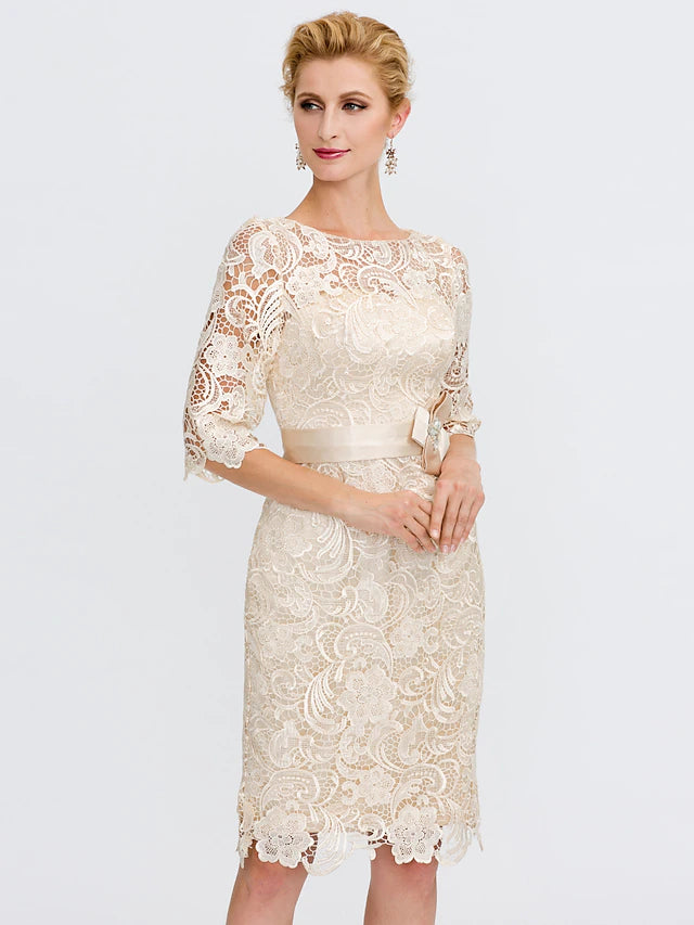 Plus size wedding guest dress with 3/4 sleeves and bow accent.