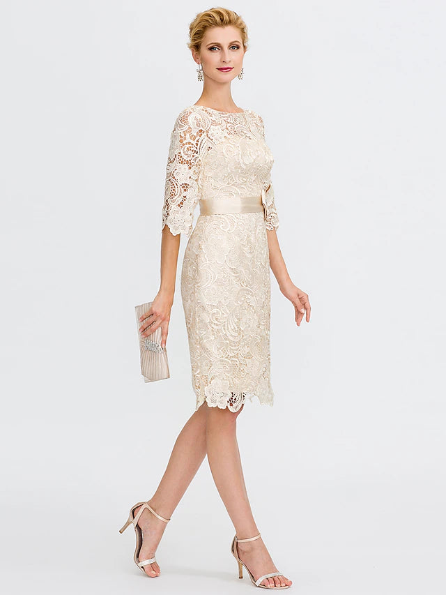Detail of the all-over lace pattern on the sheath column dress.