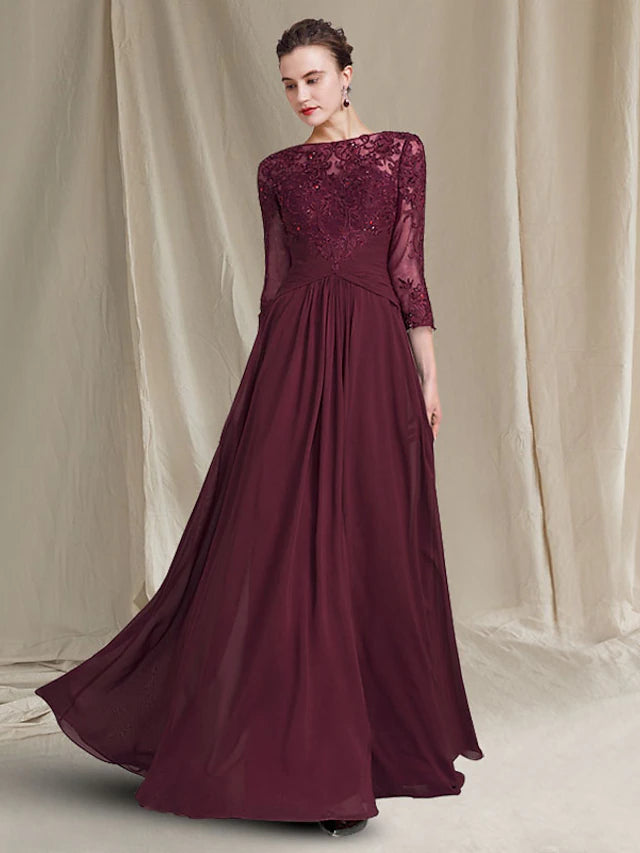Close-up of the jewel neck and 3/4 length lace sleeves on the elegant gown.