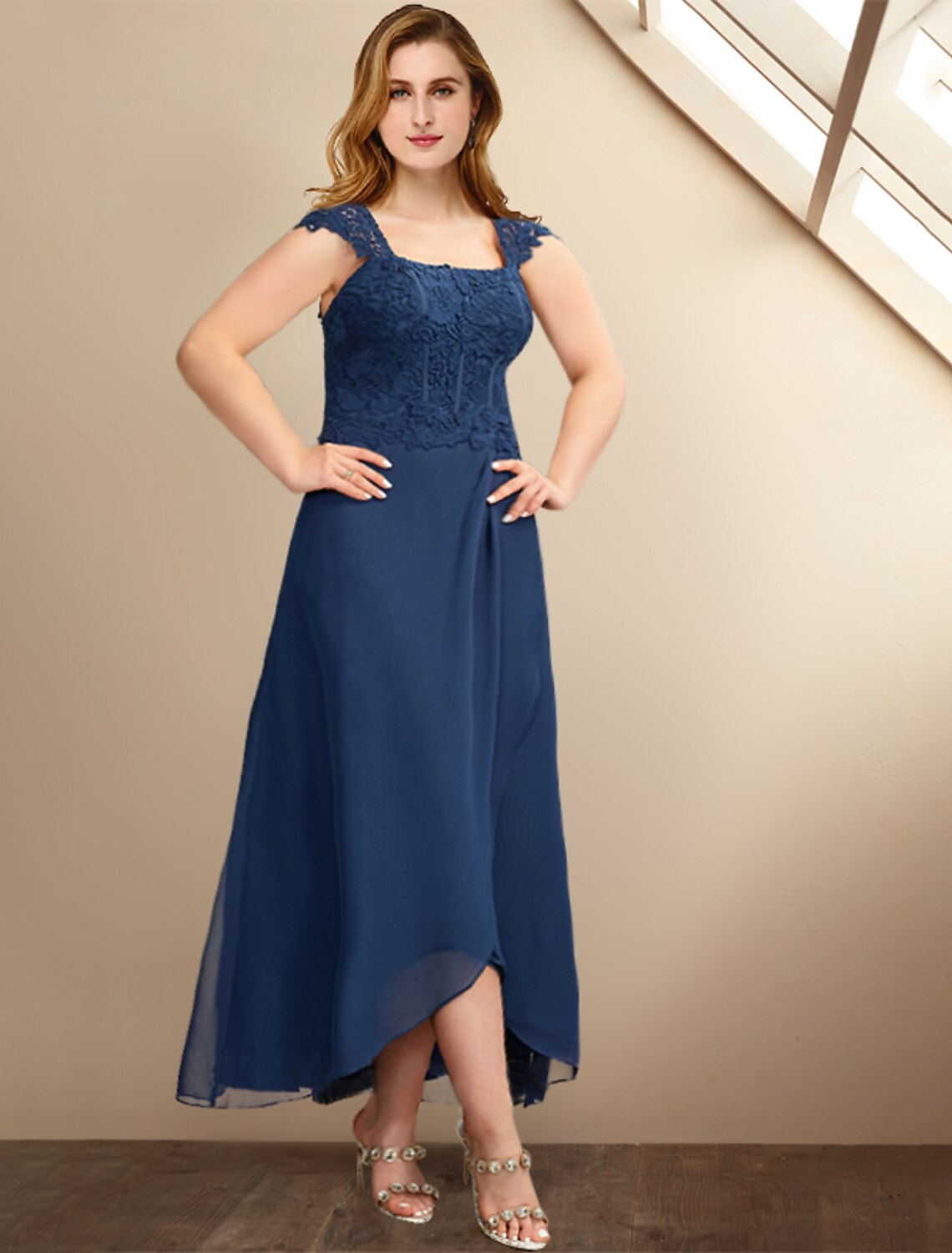 Detail of the pleats and appliques on the formal plus size A-line dress.
