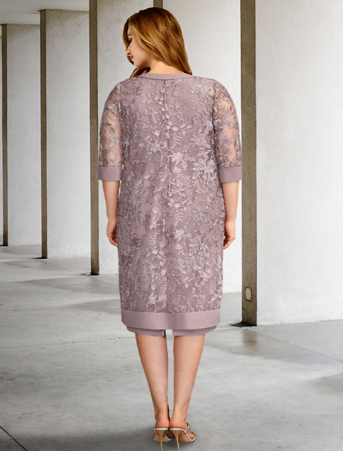 Back view of the two-piece A-line dress showing the flowing chiffon fabric.