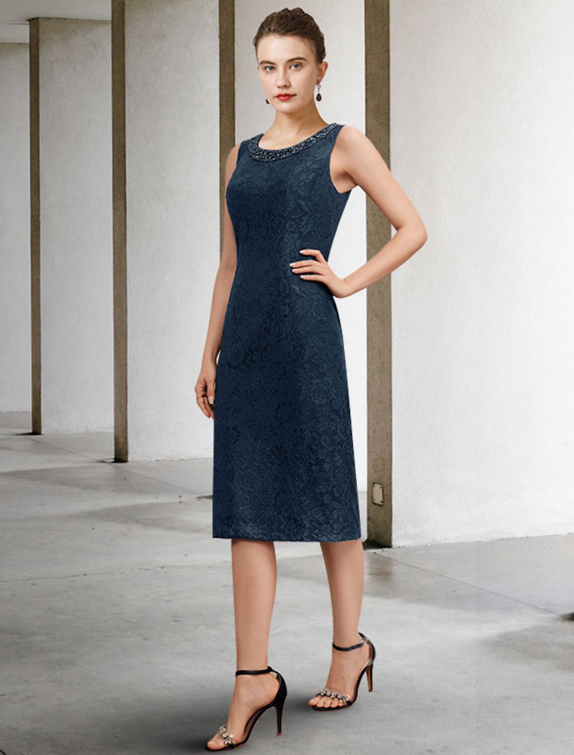 Back view of an elegant plus size two-piece sheath dress, showcasing the knee-length skirt.