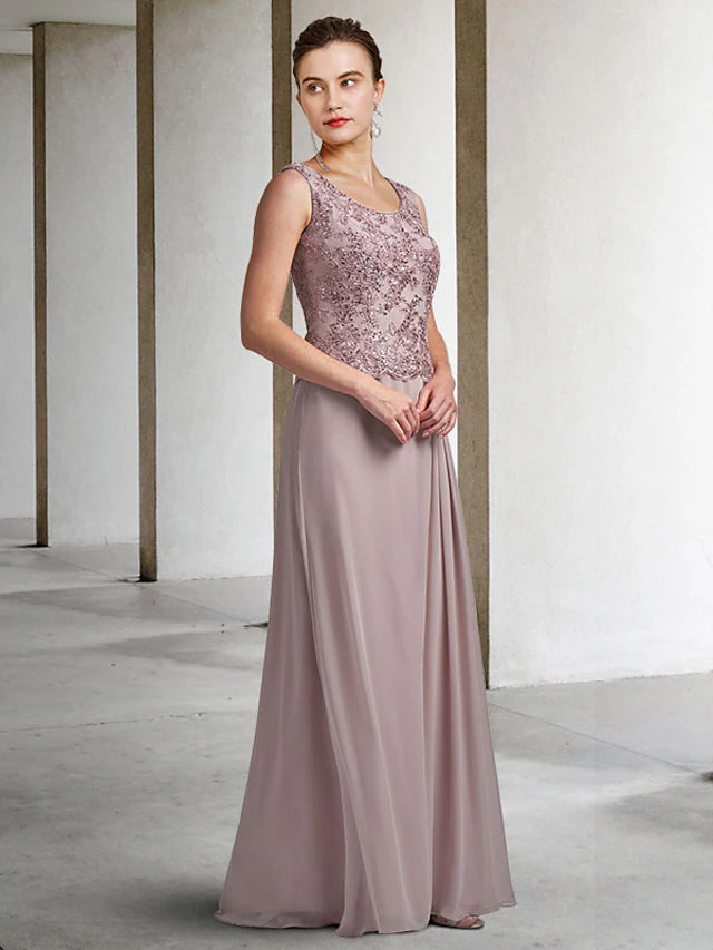 Close-up of the intricate lace and sequin appliques on the two-piece formal gown.