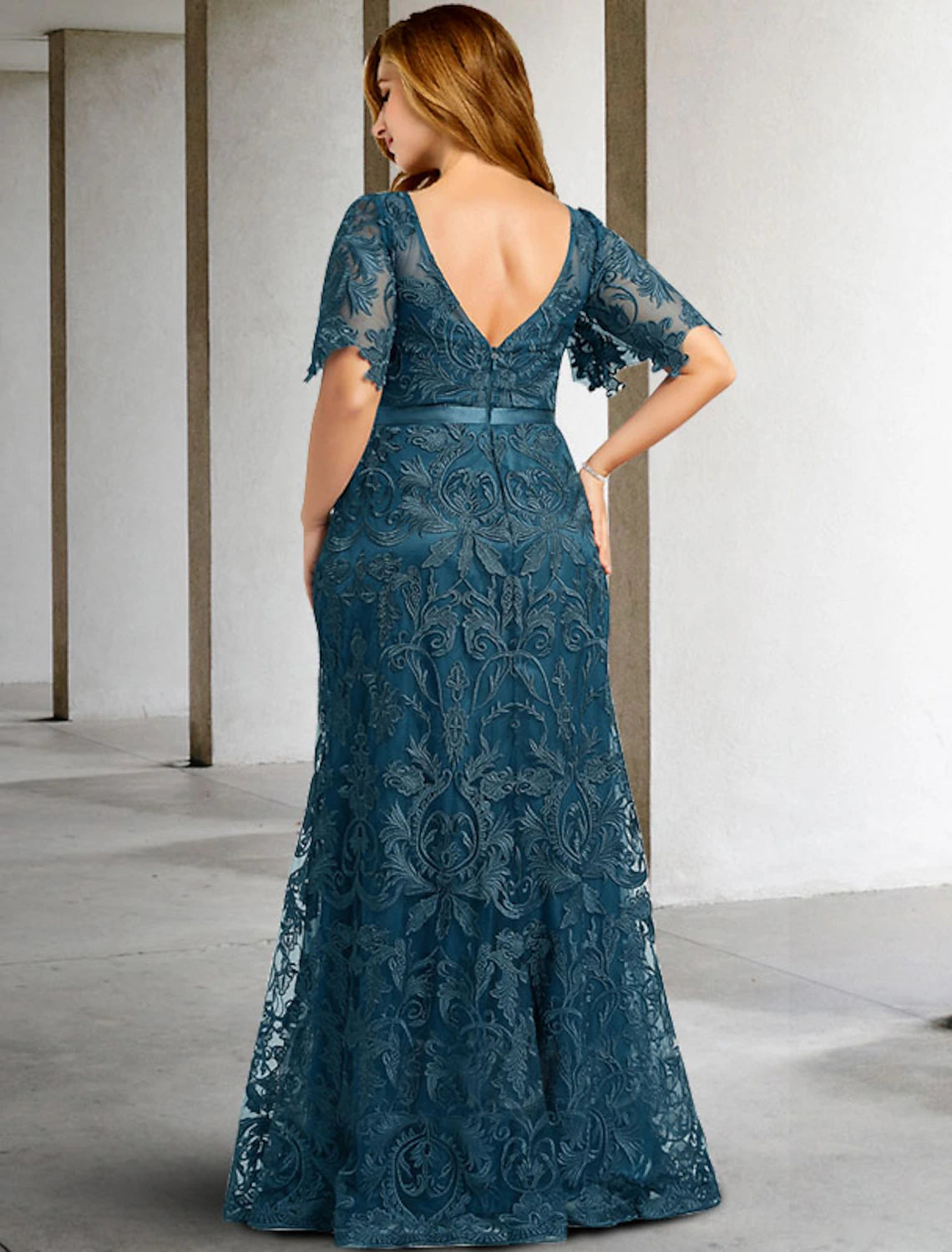 Close-up of lace detail and jewel neckline on a two-piece Mother of the Bride dress.