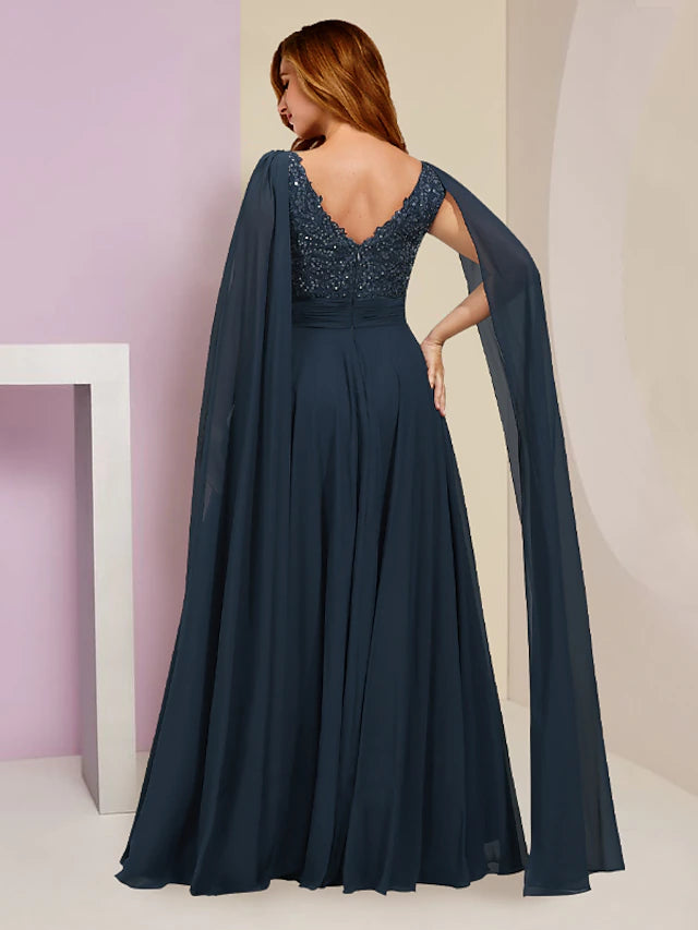Side profile of a formal Plus Size dress featuring pleats and a flowing skirt.