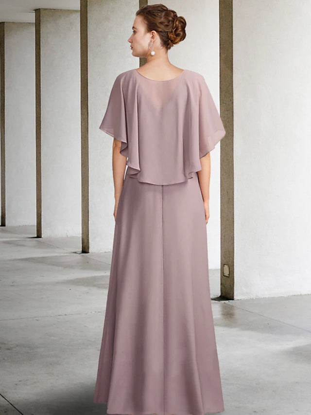 Close-up of the V-neckline and pleated details on the elegant chiffon dress.