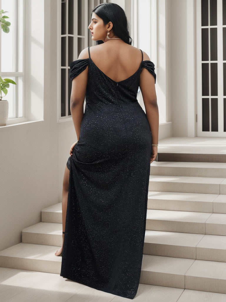 Black floor-length gown with cold shoulder sleeves.
