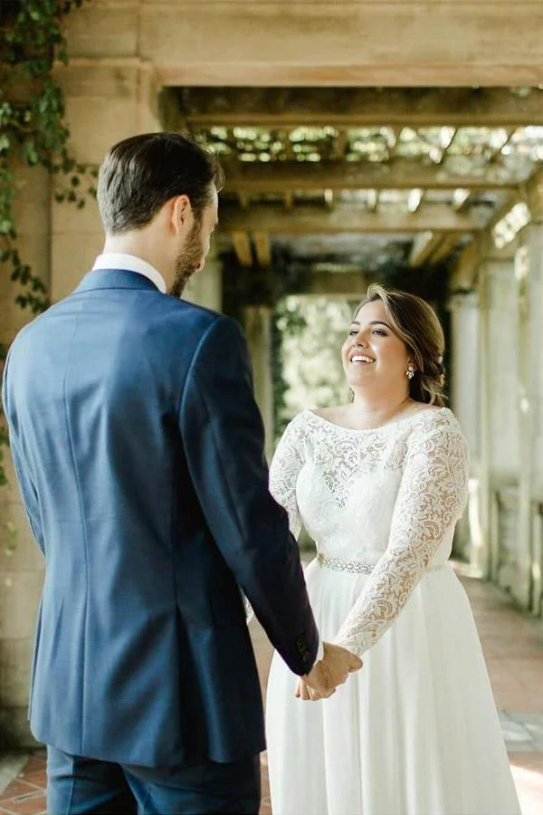 Side view of a plus size A-line wedding dress featuring a lace bodice.