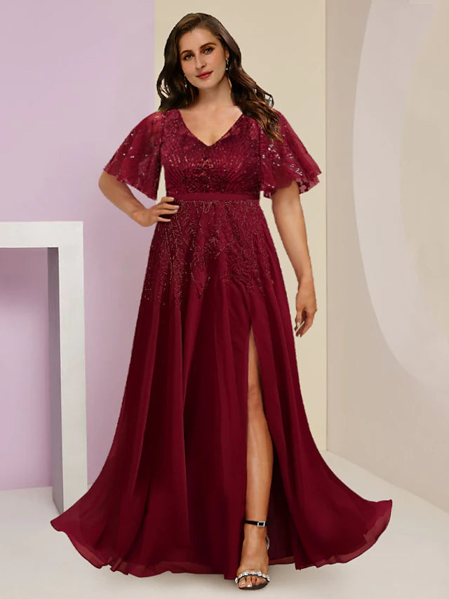Woman wearing an elegant plus size V-neck short sleeve sequin floor length dress.
